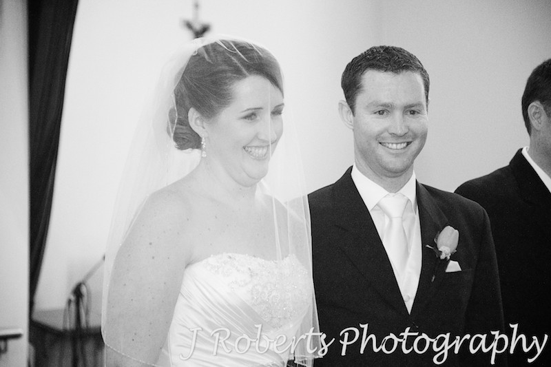 Bride and groom laughing during wedding ceremony - wedding photography sydney